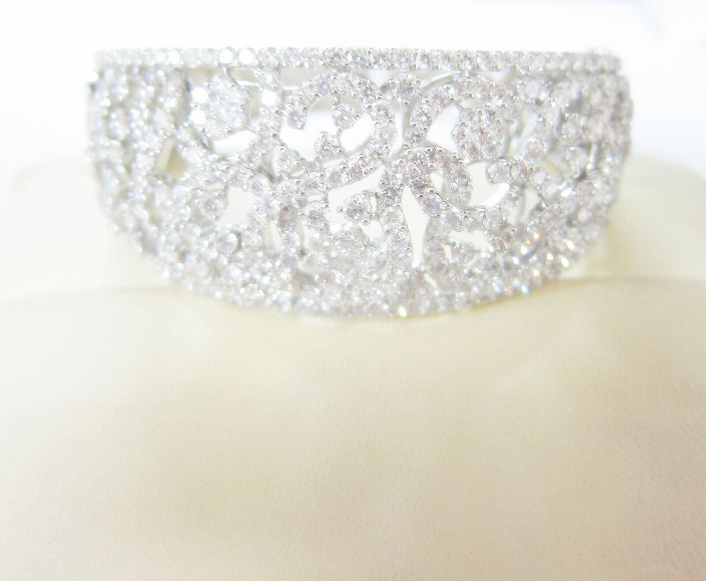 DIAMOND ROUND BRILLIANT FLOWER SWIRL BANGLE TOP GRADUATED TO BOTTOM