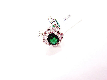 emerald two oval set triangular halo stud earring