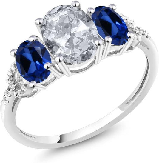 10K White Gold White Topaz Blue Created Sapphire and Diamond Accent 3-Stone Engagement Ring for Women (2.35 Cttw)