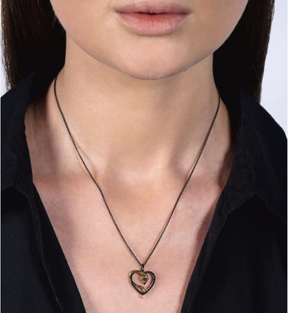 Enchanted Disney Fine Jewelry Black Rhodium over Sterling Silver and 10K Yellow Gold 1.75MM round Garnet and 1/5 Cttw Treated Black round Diamond Jafar Heart Pendant Necklace, 18" Cable Chain