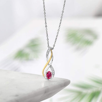 10K Yellow Gold and 925 Sterling Silver Red Created Ruby and White Lab Grown Diamond Pendant Necklace for Women (0.56 Cttw, Gemstone July Birthstone, Oval 6X4MM, with 18 Inch Silver Chain)